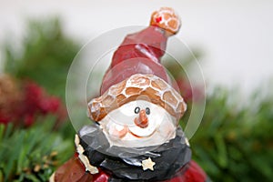 Wooden snowman with red cap