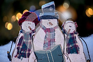 Wooden snowman trio still life