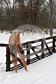 Wooden Snowshoes against a foot bridge Wild River State Park Taylors Falls Minnesota Vertical