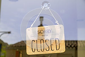 Wooden sorry we are closed or open sign board wood on windows shop restaurant cafe store signboard