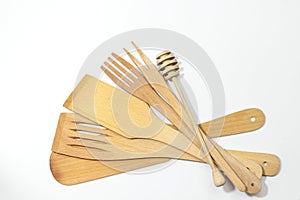 Wooden spatulas and forks isolated