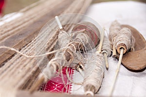 Wooden spindles with hemp threads