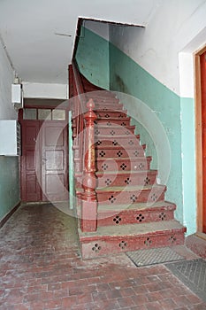 Wooden spiral staircase at an entrance of the old German house