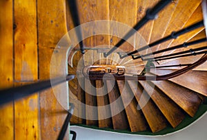 Wooden spiral staircase in old building, Paris, France