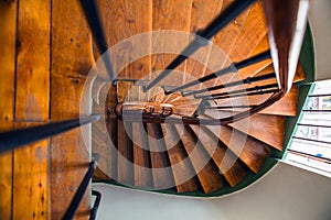 Wooden spiral staircase in old building, Paris, France
