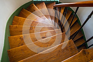 Wooden spiral staircase in old building, Paris, France