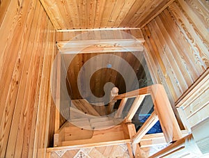 Wooden spiral staircase from the second floor to the first