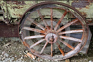 A wooden spoked wheel on an old wagon