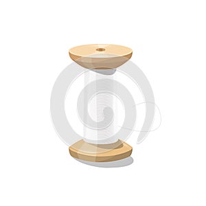 Wooden spool - bobbin with white thread isolated