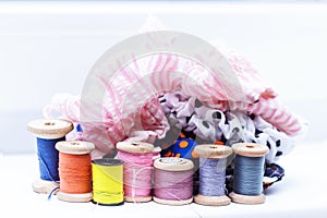 Wooden spools with multicolored threads