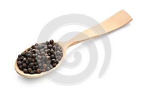 Wooden spoon with black pepper grains