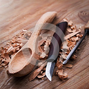 Wooden spoon with carvin tools