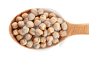 Wooden spoon with chickpeas on white background.