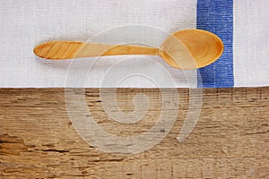 Wooden spoon and dishcloth