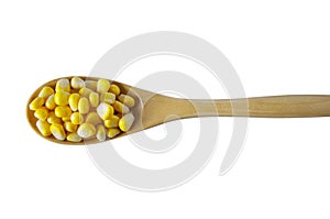 Wooden spoon, filled, fresh, corn, white background