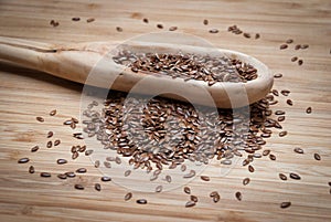 A wooden spoon with flax seeds