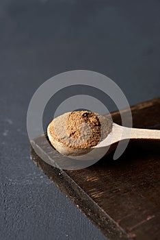 Wooden spoon full of camu-camu powder photo