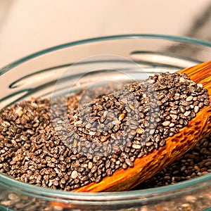 Wooden Spoon In A Glass Jar Filled With Chia Seeds