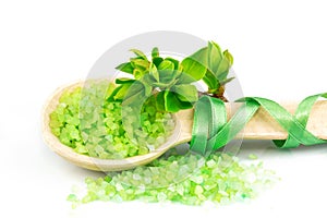 Wooden spoon with green bath salt