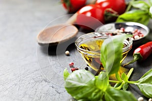 Wooden spoon and ingredients on old background