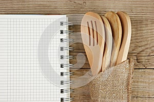 Wooden spoon and notebook