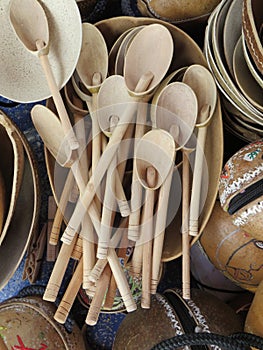 Wooden spoon and other wooden kitchen handmade tools on a table