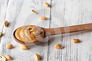 Wooden spoon of peanut butter