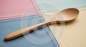 Wooden spoon resting on a patchwork