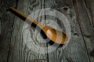 wooden spoon on a rustic table photo
