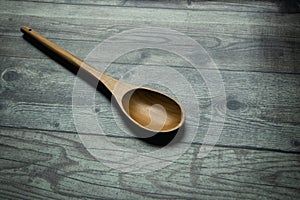 wooden spoon on a rustic table photo