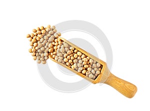 wooden spoon or scoop with soybeans isolated on white background top view. soybeans in a wooden spoon