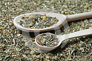 Wooden spoon and various herbs in a herbalist