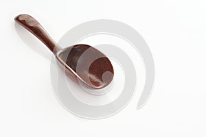 Wooden spoon on white background