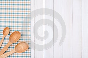 Wooden spoons on tablecloth