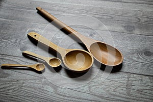 wooden spoons on a rustic table photo