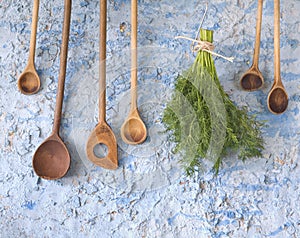 wooden spoons w. dill herbs photo