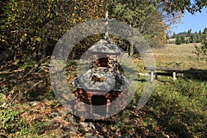 Wooden spring well in the mountains