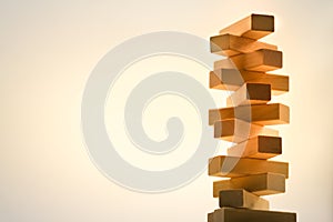 Wooden stack tower from wood blocks toy on abstract background