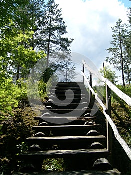 Wooden staircase on the cliff. Descent or ascent. Natural idyll. Kondopoga district, Karelia, Russia. Summer in the Scandinavian