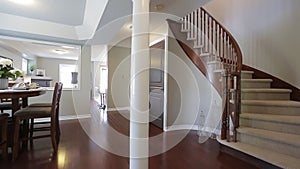 Wooden staircase leading to the upper floor .