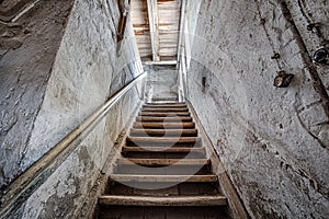 Wooden stairs in an abandoned house