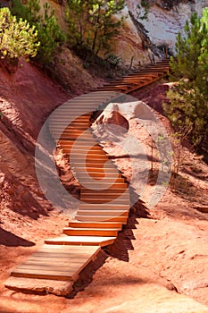Wooden stairs on Le Sentier des Ocres in Roussillon in France