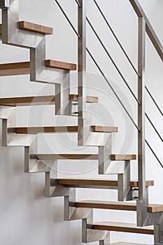 Wooden stairs with silver balustrade