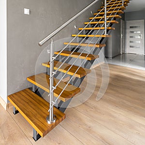 Wooden stairs with silver railing