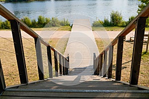 Wooden stairs to acces river coast in Vichy city France