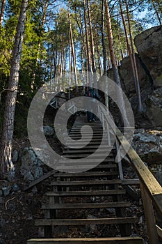 Wooden stairs to the peak of the rock in the national park Repovesi, Finland