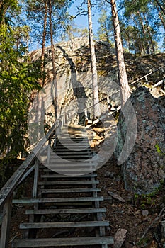 Wooden stairs to the peak of the rock in the national park Repovesi, Finland