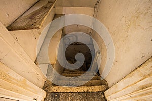 Wooden stairs to the scary dark basement