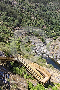 Wooden stairs and walkway around the mountain