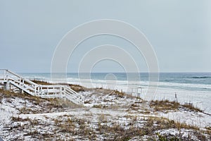 Wooden stairway leads over dunes to white sand beach, Destin